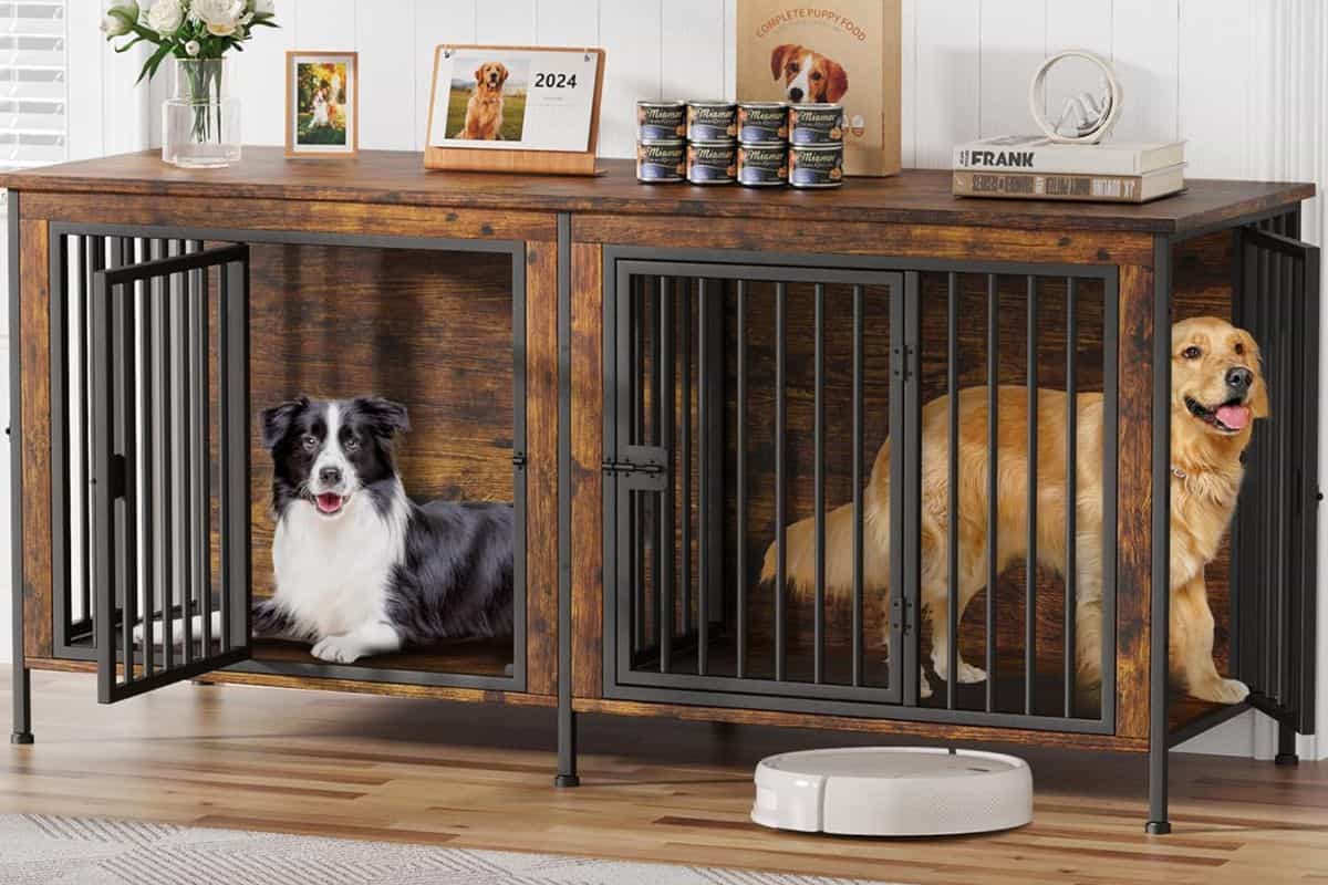 Two dogs inside a wooden heavy-duty dog crate furniture cabinet.
