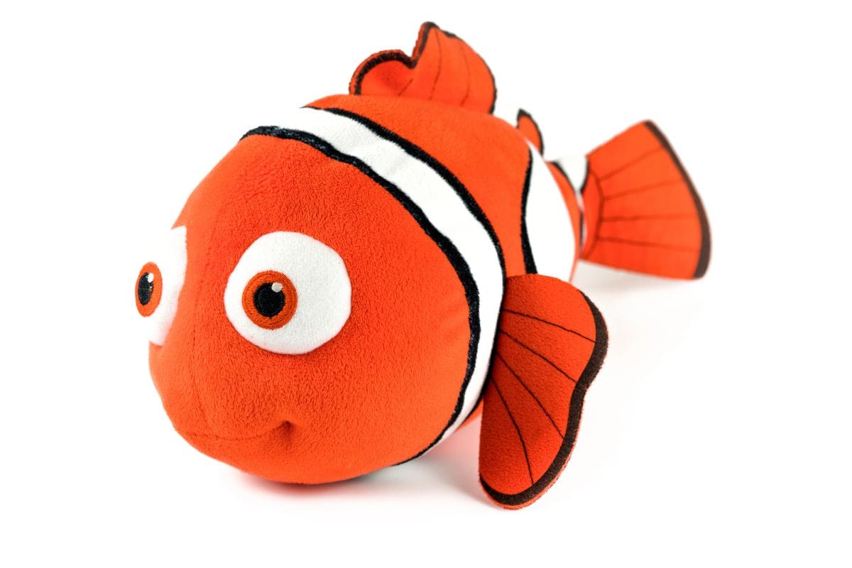 Orange clownfish plush toy on a white background.