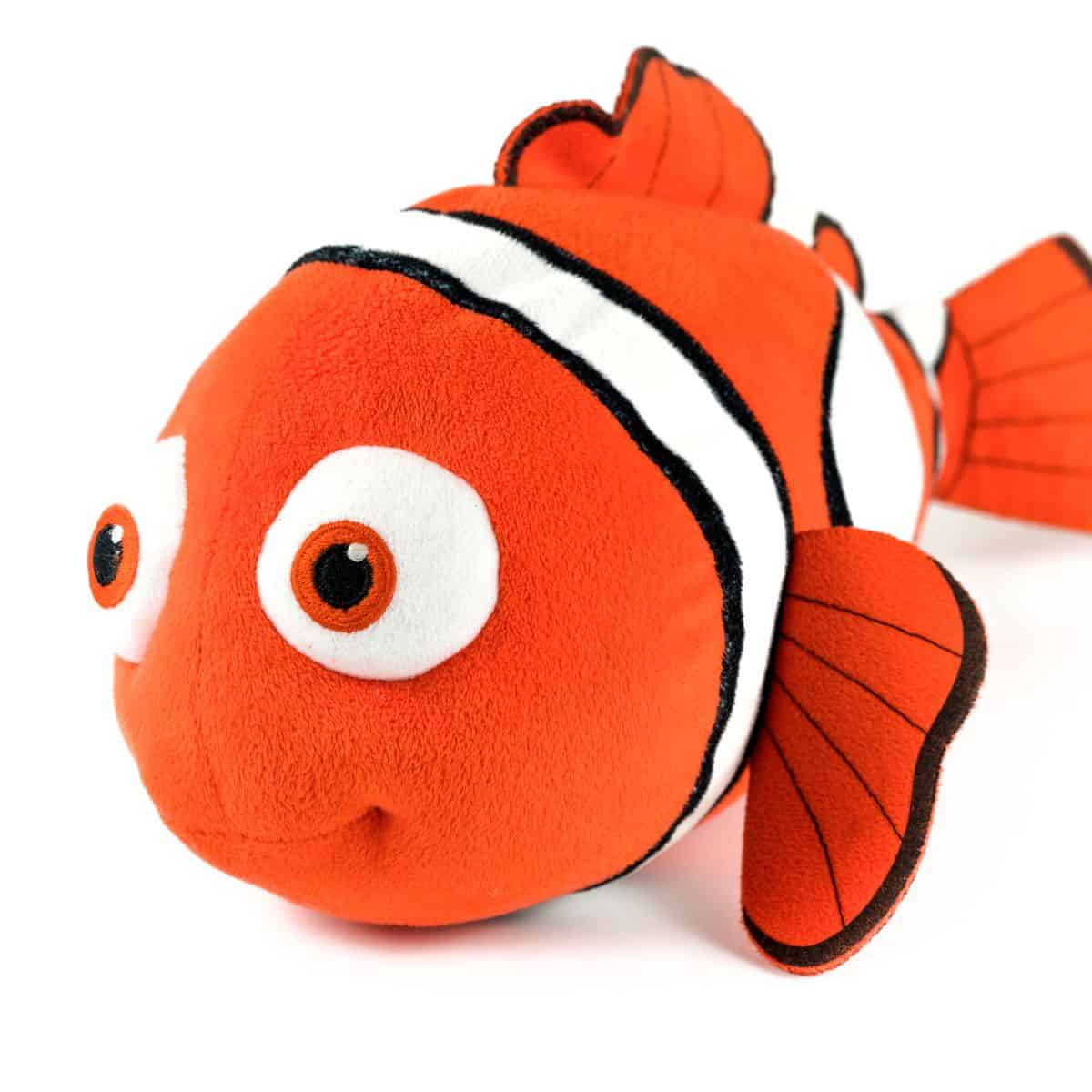 Orange clownfish stuffed toy isolated on a white background.